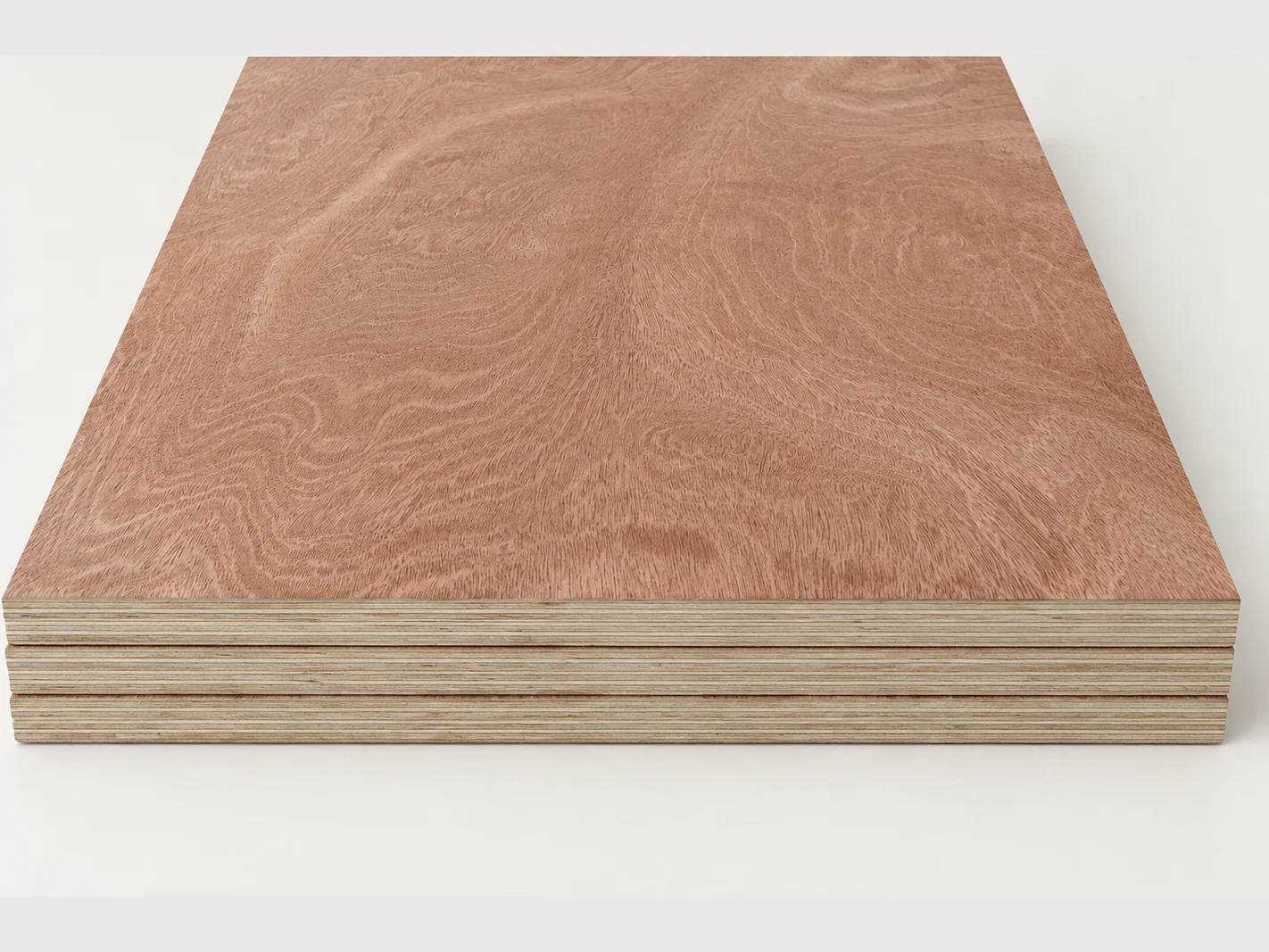 A small stack of commercial plywood panels with reddish-brown hardwood faces and layered edges