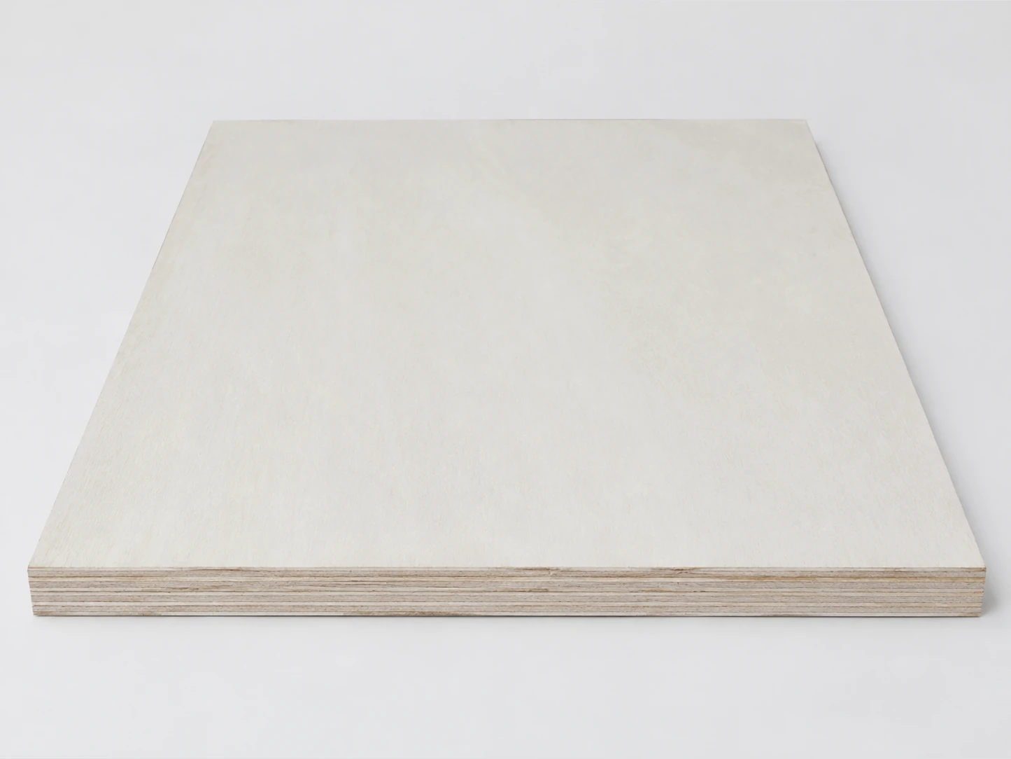 One full poplar-faced plywood panel lying on a pale surface, its creamy-white face almost plain and its edge showing thin layers